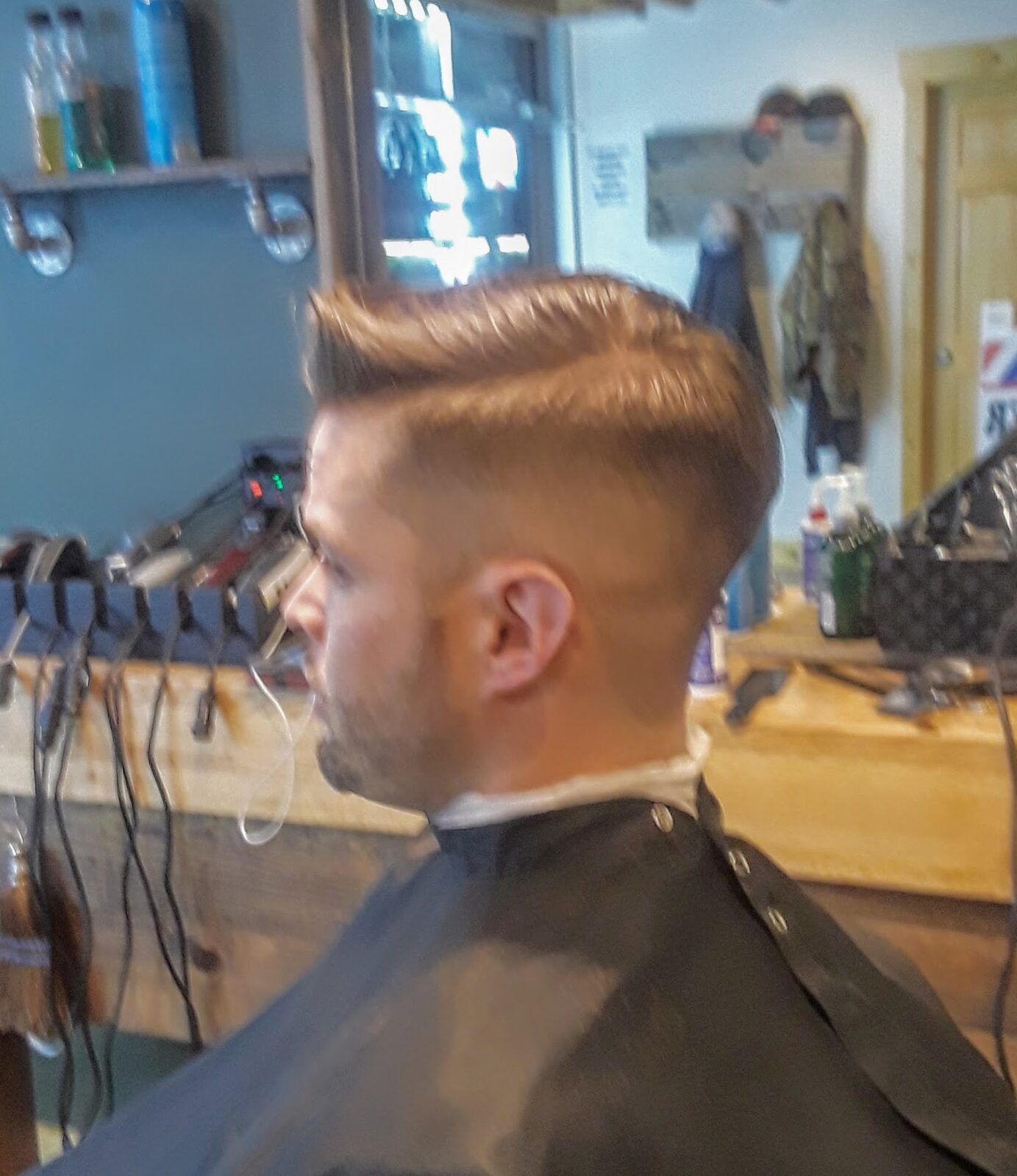 Side-part fade haircut at Quincy Barbers, Englewood CO