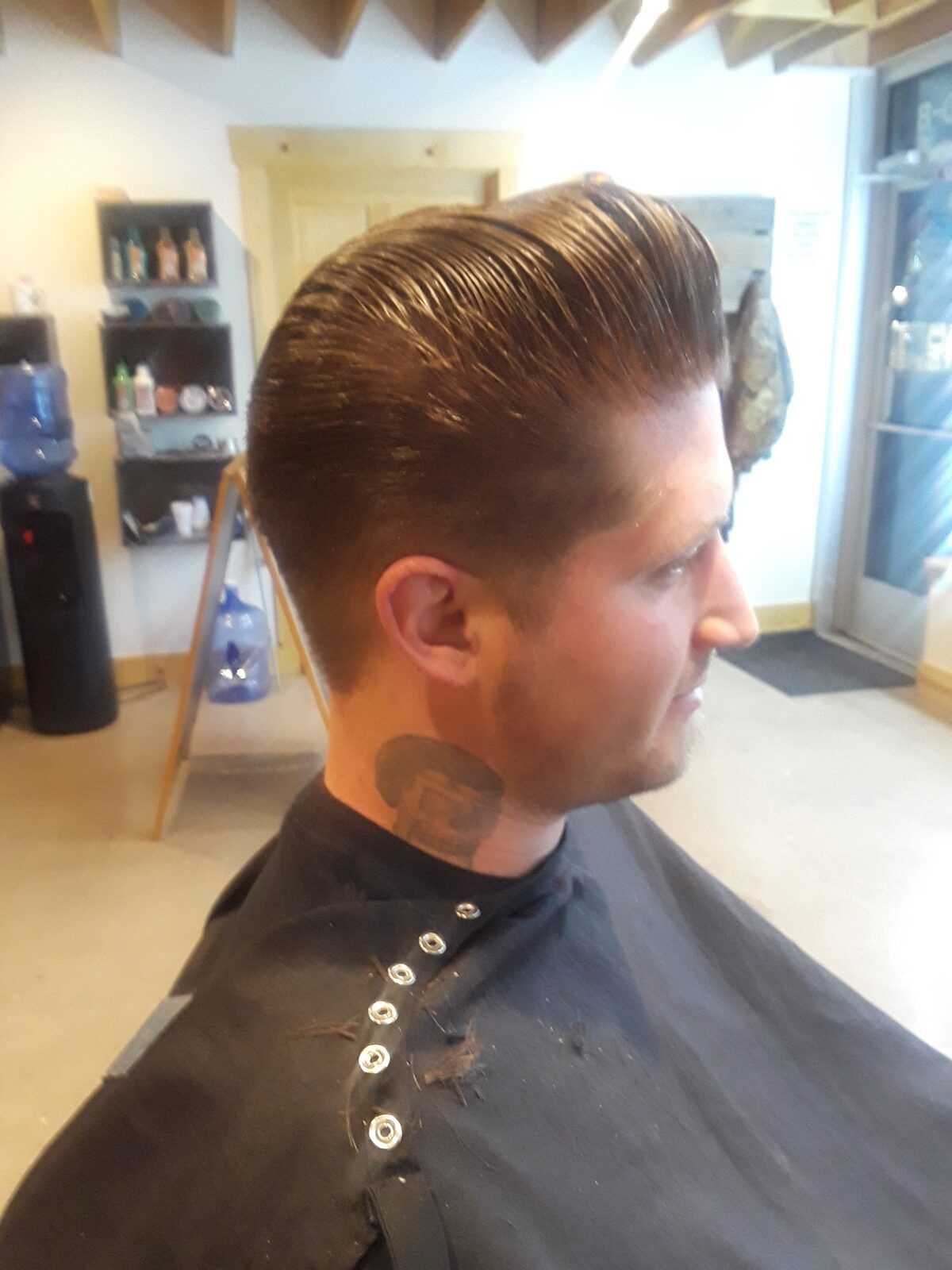Slicked-back pompadour with taper, Quincy Barbers